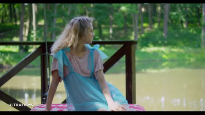 Spicy as hell doll Clarice opens her pink naked pussy by the lake